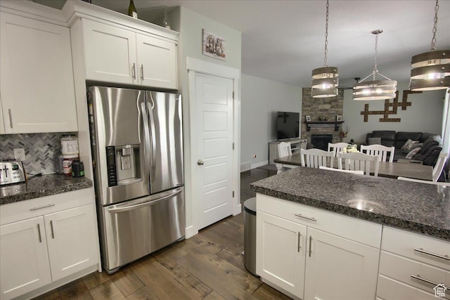 342 E Chiswick Ct, Stansbury Park, UT 84074 - kitchen featuring stainless steel refrigerator with ice dispenser, tasteful backsplash, white cabinets, dark wood finished floors, and open floor plan