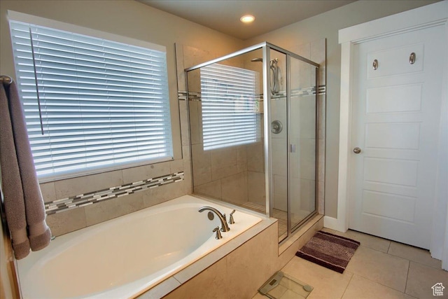342 E Chiswick Ct, Stansbury Park, UT 84074 - bathroom featuring a bath, a stall shower, and tile patterned flooring