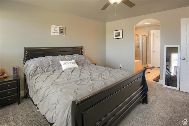 342 E Chiswick Ct, Stansbury Park, UT 84074 - bedroom with carpet, arched walkways, ensuite bathroom, and ceiling fan