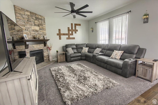 342 E Chiswick Ct, Stansbury Park, UT 84074 - living room with ceiling fan, a stone fireplace, and wood finished floors