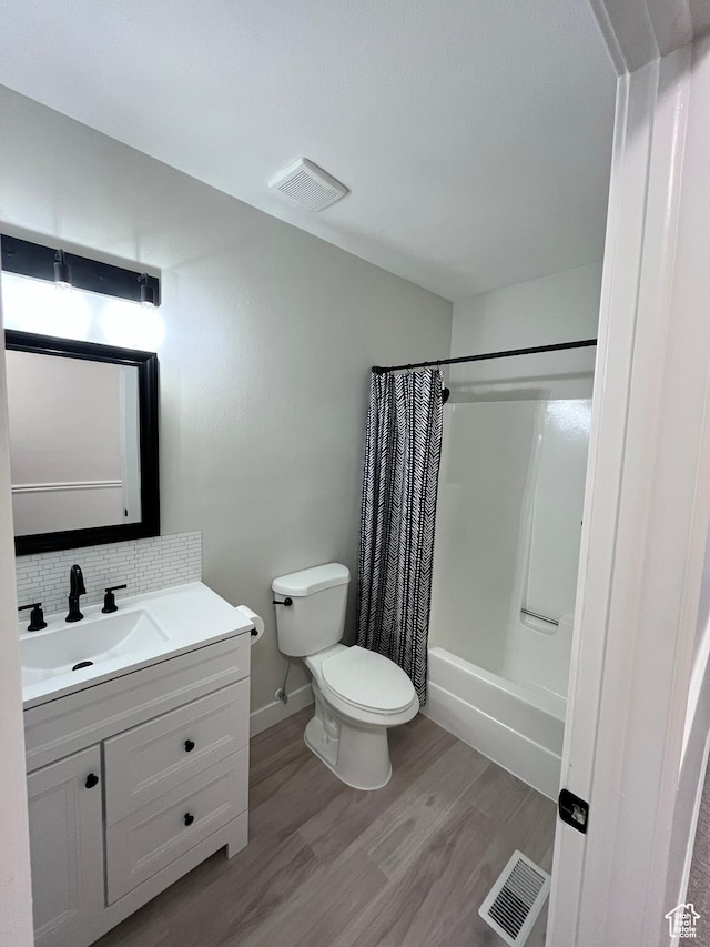 345 E 350 N, Salem, UT 84653 - full bath featuring vanity, wood finished floors, shower / bathtub combination with curtain, and backsplash