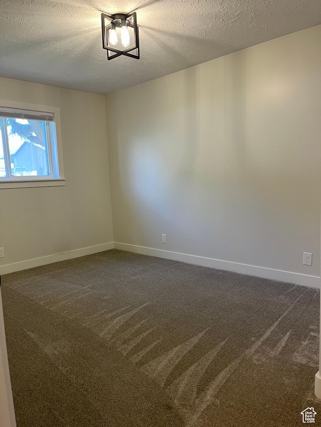 345 E 350 N, Salem, UT 84653 - spare room with dark colored carpet and a textured ceiling