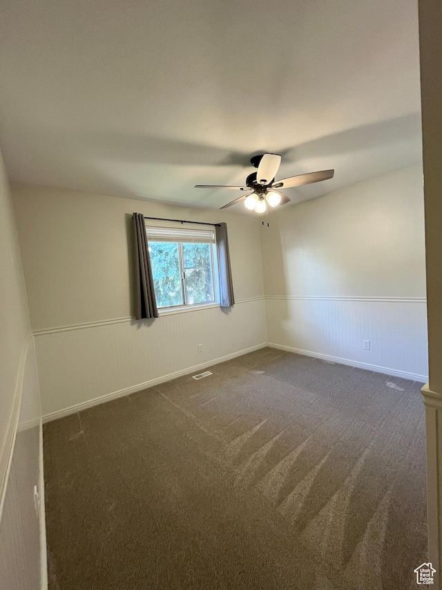 345 E 350 N, Salem, UT 84653 - empty room with dark carpet, a wainscoted wall, and a ceiling fan