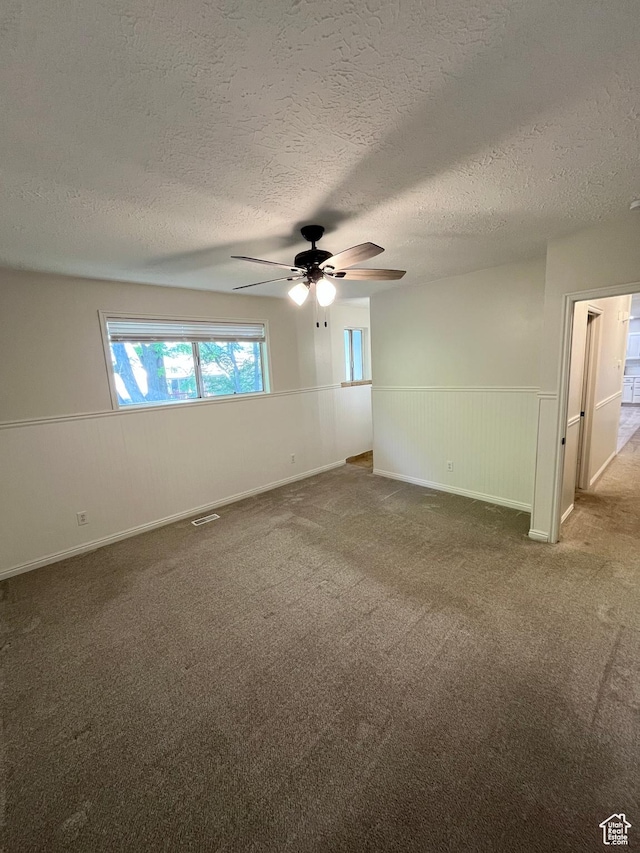 345 E 350 N, Salem, UT 84653 - spare room with ceiling fan, carpet, a wainscoted wall, and a textured ceiling