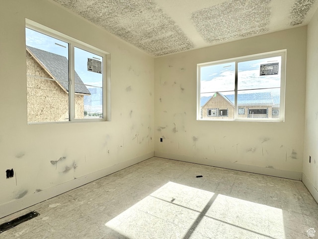2727 N 2775 W Unit 122, Plain City, UT 84404 - unfurnished room with baseboards