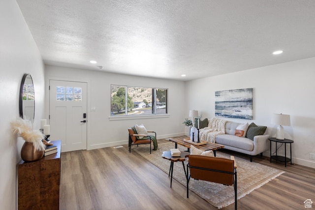 1488 E 580 S, Provo, UT 84606 - living area featuring wood finished floors, plenty of natural light, recessed lighting, and a textured ceiling