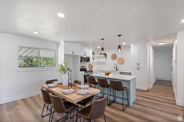 1488 E 580 S, Provo, UT 84606 - dining room with wood finished floors, recessed lighting, and a textured ceiling