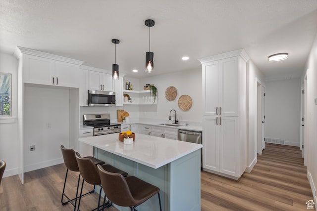 1488 E 580 S, Provo, UT 84606 - kitchen with appliances with stainless steel finishes, open shelves, white cabinetry, wood finished floors, and recessed lighting