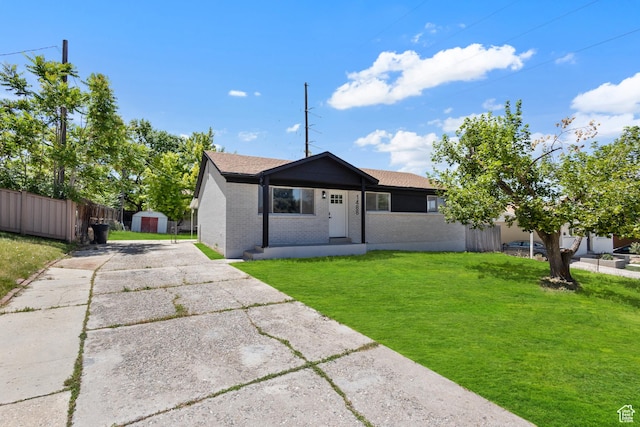 1488 E 580 S, Provo, UT 84606 - view of front of home with a storage shed, brick siding, and driveway