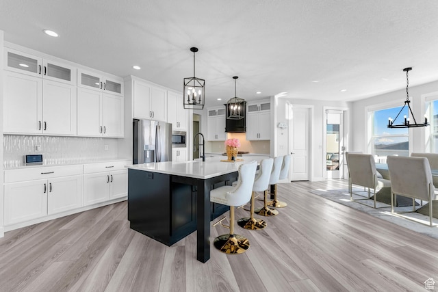 827 W 800 N, American Fork, UT 84003 - kitchen with a chandelier, stainless steel appliances, light countertops, light wood-style flooring, and recessed lighting