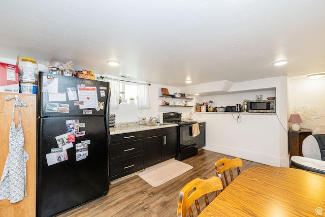 141 W 400 N, Logan, UT 84321 - kitchen featuring black appliances, dark cabinets, light wood-style floors, and open shelves