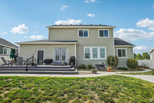 2577 W Garden Creek Way Unit 106, West Jordan, UT 84088 - rear view of property with french doors and a wooden deck