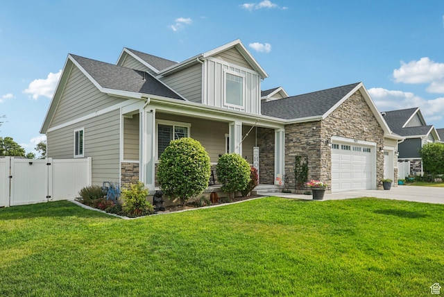 2577 W Garden Creek Way Unit 106, West Jordan, UT 84088 - craftsman-style home featuring a gate, stone siding, an attached garage, a porch, and driveway
