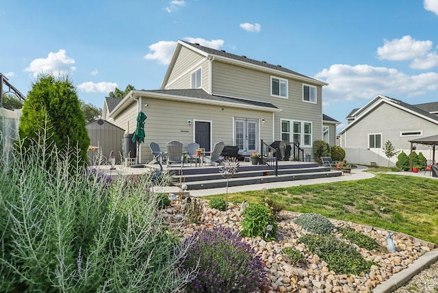 2577 W Garden Creek Way Unit 106, West Jordan, UT 84088 - back of house with a shed, french doors, and a wooden deck