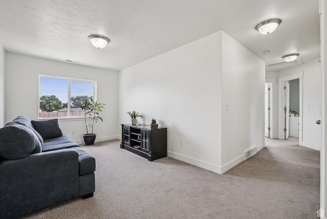 2577 W Garden Creek Way Unit 106, West Jordan, UT 84088 - living room with carpet floors and a textured ceiling