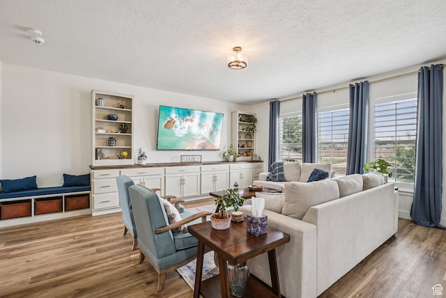 2577 W Garden Creek Way Unit 106, West Jordan, UT 84088 - living area with a textured ceiling and light wood-style flooring