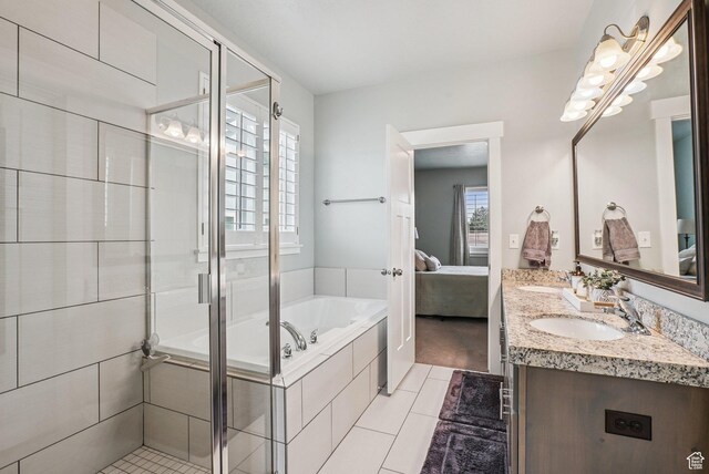 2577 W Garden Creek Way Unit 106, West Jordan, UT 84088 - ensuite bathroom with double vanity, a garden tub, tile patterned flooring, and a stall shower