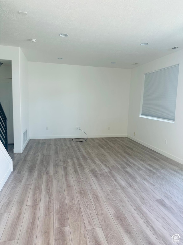 764 S 290 W, American Fork, UT 84003 - empty room featuring light wood-type flooring and a smoke detector