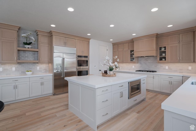 1914 E 540 S, Heber City, UT 84032 - kitchen featuring built in appliances, decorative backsplash, light countertops, a center island, and recessed lighting