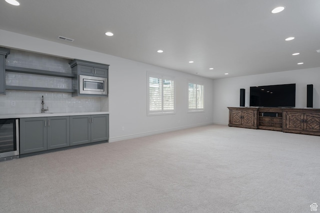 1914 E 540 S, Heber City, UT 84032 - unfurnished living room with beverage cooler, wet bar, light carpet, and recessed lighting