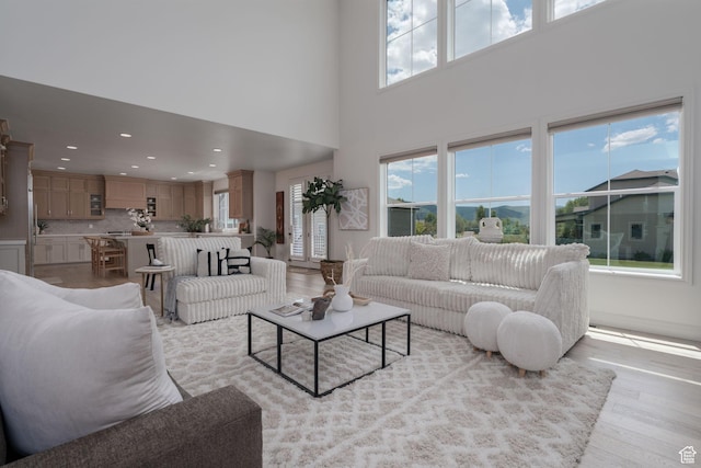 1914 E 540 S, Heber City, UT 84032 - living room featuring plenty of natural light, light wood-style flooring, a high ceiling, and recessed lighting
