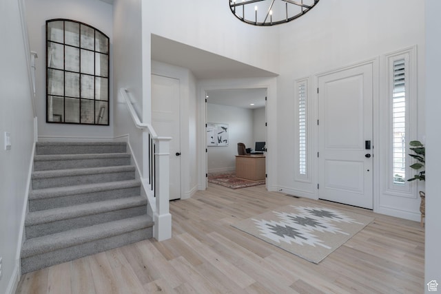 1914 E 540 S, Heber City, UT 84032 - entryway with wood finished floors, stairway, a chandelier, and a high ceiling