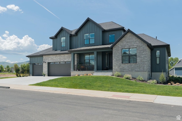 1914 E 540 S, Heber City, UT 84032 - view of front of house with board and batten siding, covered porch, a front lawn, and driveway