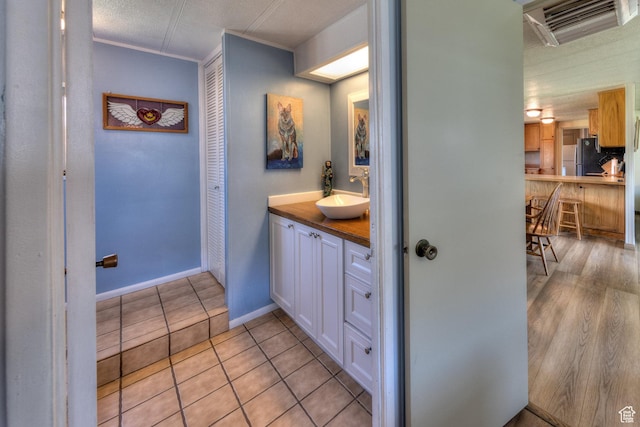 1281 Holyoak Ln E, Moab, UT 84532 - bathroom with vanity, tile patterned floors, and crown molding