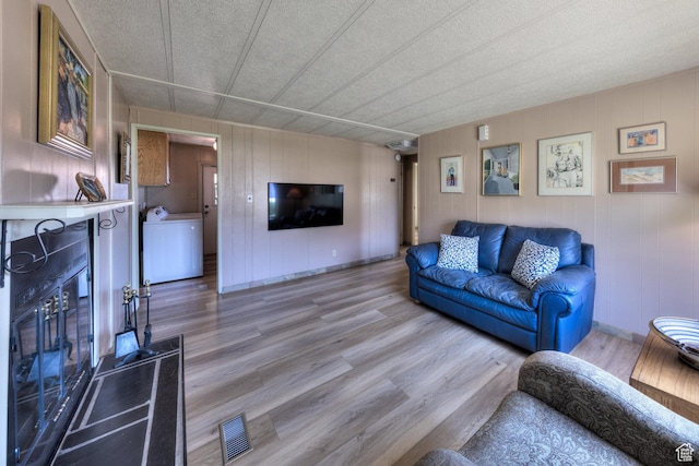 1281 Holyoak Ln E, Moab, UT 84532 - living area featuring light wood-type flooring and washer / clothes dryer