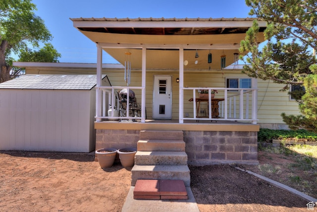 1281 Holyoak Ln E, Moab, UT 84532 - view of front of property with a porch and an outbuilding