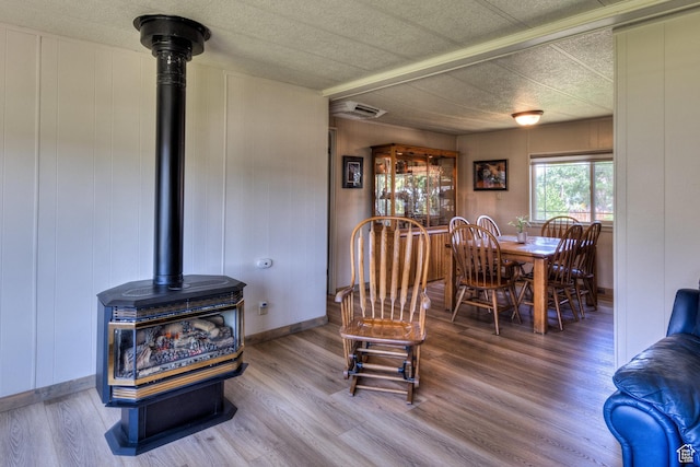 1281 Holyoak Ln E, Moab, UT 84532 - dining room with a wood stove and wood finished floors
