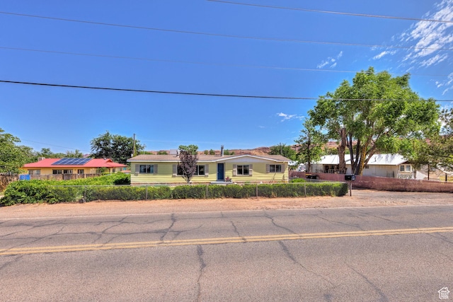 1281 Holyoak Ln E, Moab, UT 84532 - ranch-style house featuring a fenced front yard