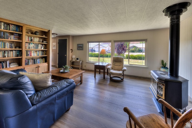 1281 Holyoak Ln E, Moab, UT 84532 - living room with a wood stove and wood finished floors