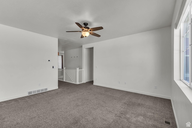 773 W Mulberry St, Stansbury Park, UT 84074 - carpeted empty room featuring a ceiling fan and baseboards