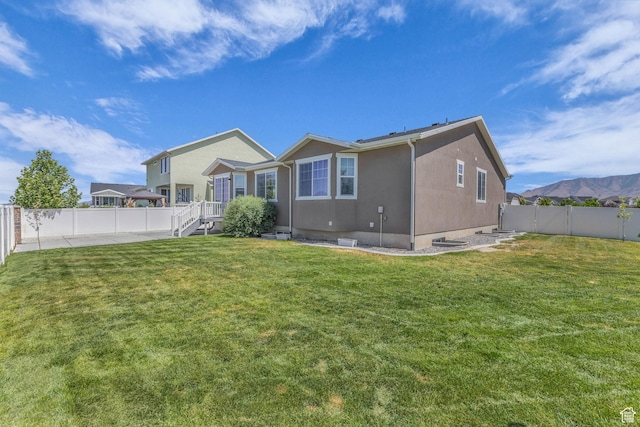 773 W Mulberry St, Stansbury Park, UT 84074 - rear view of property featuring a fenced backyard
