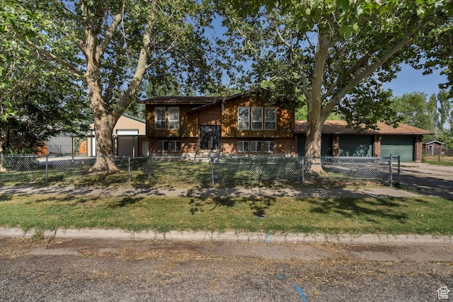 5374 S 5700 W, Hooper, UT 84315 - view of front of house with a fenced front yard, brick siding, and a garage