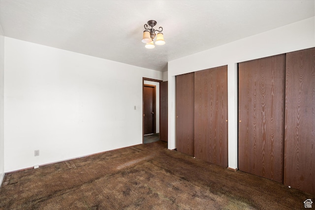 5374 S 5700 W, Hooper, UT 84315 - unfurnished bedroom featuring multiple closets, a chandelier, and carpet