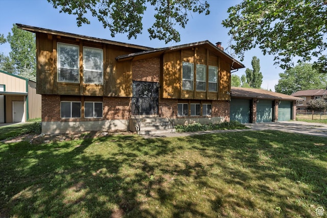 5374 S 5700 W, Hooper, UT 84315 - view of front of home featuring brick siding, concrete driveway, a front lawn, and an attached garage