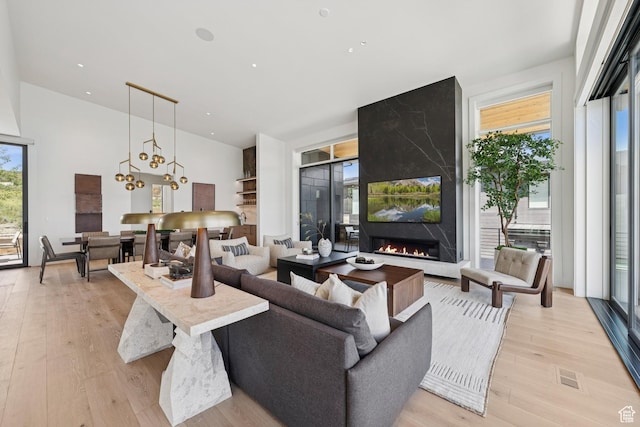 1404 W Ursa Way, Heber City, UT 84032 - living area featuring a high end fireplace and light wood finished floors