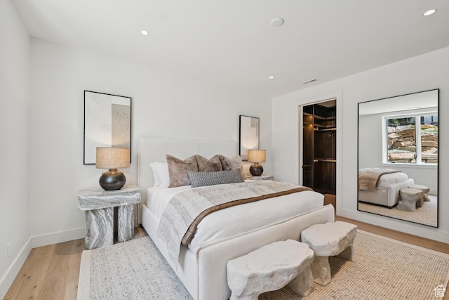 1404 W Ursa Way, Heber City, UT 84032 - bedroom featuring light wood finished floors, recessed lighting, and a spacious closet