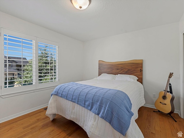 1639 E Lone Oak Dr, Draper, UT 84020 - bedroom with wood finished floors and baseboards