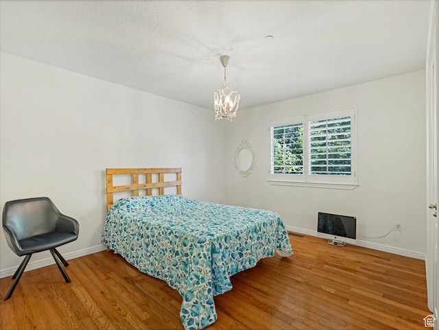 1639 E Lone Oak Dr, Draper, UT 84020 - bedroom featuring wood finished floors and a chandelier