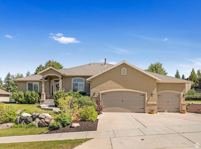 1639 E Lone Oak Dr, Draper, UT 84020 - view of front of home featuring a garage, stucco siding, and concrete driveway