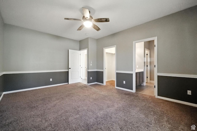 3707 S Panorama Dr, Saratoga Springs, UT 84045 - unfurnished bedroom featuring carpet flooring, a spacious closet, ceiling fan, ensuite bath, and a closet