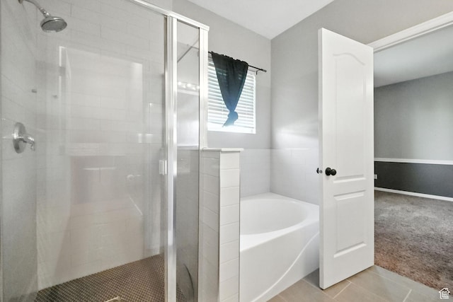 3707 S Panorama Dr, Saratoga Springs, UT 84045 - bathroom with a garden tub, a stall shower, and tile patterned floors