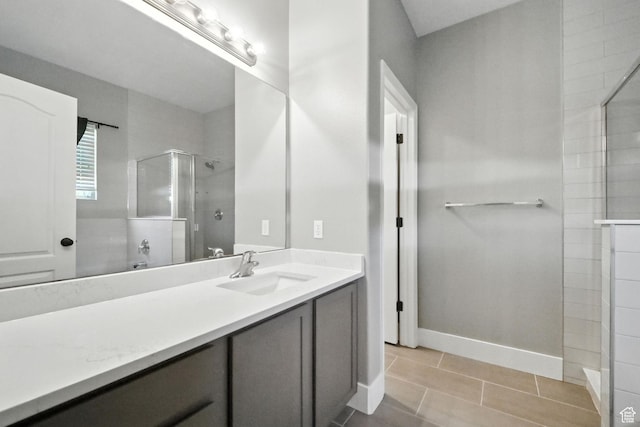 3707 S Panorama Dr, Saratoga Springs, UT 84045 - bathroom with tiled shower, vanity, and tile patterned flooring