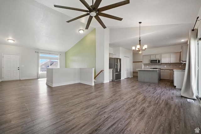 3707 S Panorama Dr, Saratoga Springs, UT 84045 - unfurnished living room featuring a chandelier, lofted ceiling, a ceiling fan, and dark wood-style floors