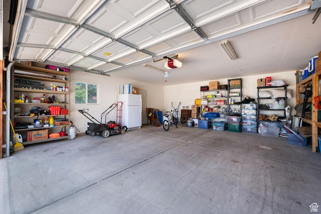 10 E 200 N, La Verkin, UT 84745 - garage with a garage door opener and freestanding refrigerator