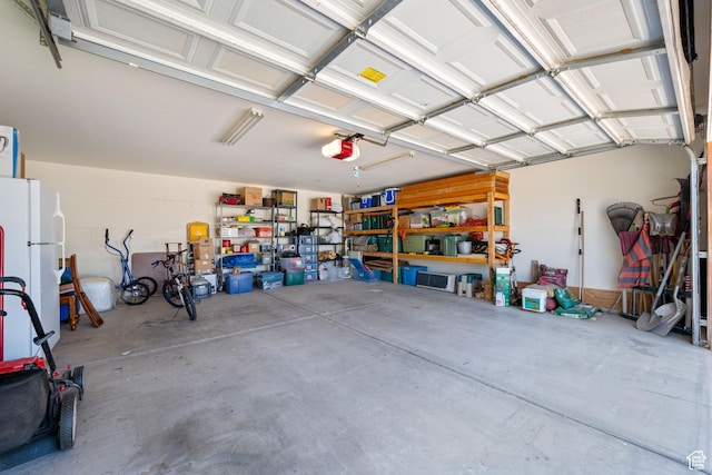10 E 200 N, La Verkin, UT 84745 - garage with freestanding refrigerator and a garage door opener