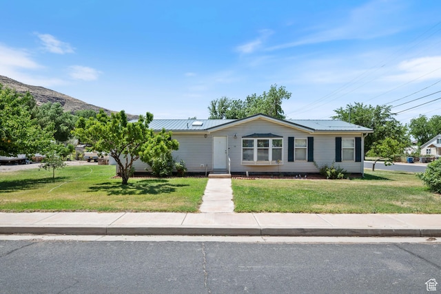 10 E 200 N, La Verkin, UT 84745 - view of front of home with a front yard and a metal roof